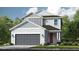 Charming two-story home with a modern design, featuring a gray garage door and a cozy front porch at 5684 Gingham Dr, Kissimmee, FL 34758