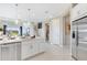 Modern kitchen featuring a large island, stainless steel appliances, and open layout at 5684 Gingham Dr, Kissimmee, FL 34758