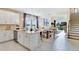 Open concept living space with a bright kitchen, dining room and living room at 5684 Gingham Dr, Kissimmee, FL 34758