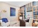 Cozy office space with dark wood desk, shelving, and white chair at 5684 Gingham Dr, Kissimmee, FL 34758