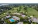 Aerial view showcasing the golf course and community pool, offering a resort-style living experience at 5913 Masters Blvd, Orlando, FL 32819