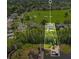 Stunning aerial view of lakeside home with boat dock and golf course access at 5913 Masters Blvd, Orlando, FL 32819