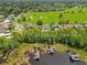 Breathtaking aerial view of lakefront homes with boat docks near the golf course at 5913 Masters Blvd, Orlando, FL 32819