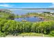 Stunning aerial view of a lakeside community boasting private docks and serene water views, located close to open lake at 5913 Masters Blvd, Orlando, FL 32819