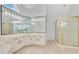 Bright bathroom features spacious vanity with ample lighting and a glass-enclosed shower at 5913 Masters Blvd, Orlando, FL 32819