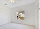 Bedroom featuring neutral walls, carpet flooring, and natural light from window at 5913 Masters Blvd, Orlando, FL 32819