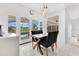Dining room with views of screened in porch and pool outside the sliding glass doors at 5913 Masters Blvd, Orlando, FL 32819