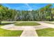 Circular driveway with manicured landscaping, enhancing the curb appeal of the property at 5913 Masters Blvd, Orlando, FL 32819