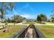 Charming home exterior with a well-manicured front yard, showcasing its inviting curb appeal at 5913 Masters Blvd, Orlando, FL 32819