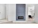 Contemporary fireplace with an accent wall, complemented by views of the dining room at 5913 Masters Blvd, Orlando, FL 32819