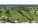 Expansive golf course aerial view featuring pristine greens, sand traps, and lush landscaping for premier recreation at 5913 Masters Blvd, Orlando, FL 32819