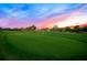 Expansive golf course with green fairways set against a beautiful sunset sky at 5913 Masters Blvd, Orlando, FL 32819