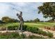 Golf statue on a manicured course surrounded by lush greenery and flowers at 5913 Masters Blvd, Orlando, FL 32819