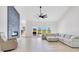 Bright living room with a statement fireplace, vaulted ceiling, and sliding glass doors at 5913 Masters Blvd, Orlando, FL 32819