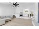 Open concept living room with vaulted ceilings and staircase leading to elevated foyer at 5913 Masters Blvd, Orlando, FL 32819