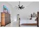 Bright and airy main bedroom showcasing contemporary design with high ceilings and stylish furniture at 5913 Masters Blvd, Orlando, FL 32819