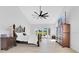 Bright main bedroom with a ceiling fan, nice furnishings, and a pool view from the french doors at 5913 Masters Blvd, Orlando, FL 32819