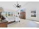 Large main bedroom with a high ceiling, ample natural light, and view of the outdoor space at 5913 Masters Blvd, Orlando, FL 32819