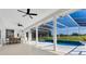 The covered patio has a seating area, summer kitchen, pool, and golf course views at 5913 Masters Blvd, Orlando, FL 32819