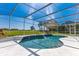 Screened in pool with a built-in spa and views of the golf course at 5913 Masters Blvd, Orlando, FL 32819