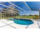 Screened in pool with a built-in spa and views of the golf course at 5913 Masters Blvd, Orlando, FL 32819