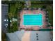 Aerial view of the community pool surrounded by lounge chairs and umbrellas, perfect for relaxation and recreation at 5913 Masters Blvd, Orlando, FL 32819