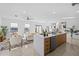 Spacious open floor plan combining the kitchen, living, and dining areas with lots of natural light and modern finishes at 6411 Chorus Dr, Mascotte, FL 34753