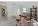 Chic home office with natural light, stylish furniture, and calming decor at 6411 Chorus Dr, Mascotte, FL 34753