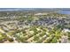 Community aerial view with lush greenery, nearby lakes and easy access to local amenities at 644 Villa Ct, Clermont, FL 34711