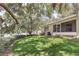 Expansive backyard with lush lawn and mature trees, perfect for outdoor activities and relaxation at 644 Villa Ct, Clermont, FL 34711