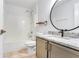 Bathroom featuring shower and tub combination, modern fixtures and granite counter at 644 Villa Ct, Clermont, FL 34711