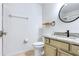 Well-lit bathroom with neutral tones, granite counters, and modern fixtures at 644 Villa Ct, Clermont, FL 34711