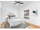Cozy bedroom with wood floors, a large window, and neutral decor creating a peaceful atmosphere at 644 Villa Ct, Clermont, FL 34711