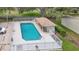 Inviting community pool with a shaded cabana, perfect for swimming and relaxing in a serene outdoor setting at 644 Villa Ct, Clermont, FL 34711