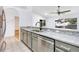 Well-equipped kitchen featuring granite countertops and stainless steel appliances in an open layout at 644 Villa Ct, Clermont, FL 34711