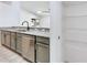 This kitchen features stainless steel appliances, granite countertops, and pantry shelves at 644 Villa Ct, Clermont, FL 34711