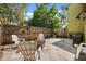 Backyard patio with fenced in yard, chairs, and fire pit at 7466 Canford Ct # 25, Winter Park, FL 32792