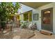 View of the front entrance of the home with a small yard area at 7466 Canford Ct # 25, Winter Park, FL 32792