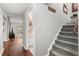 Hallway with stairs and access to the downstairs bathroom at 7466 Canford Ct # 25, Winter Park, FL 32792