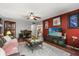 Cozy living room with wood floors, ceiling fan, and decorative artwork at 7466 Canford Ct # 25, Winter Park, FL 32792
