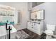 A modern bathroom showcasing a stylish vanity with marble countertop and sliding barn door accents at 7838 Rollingridge Ct, Orlando, FL 32835