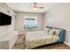 Inviting bedroom featuring a built-in window seat, a ceiling fan, and hardwood floors at 7838 Rollingridge Ct, Orlando, FL 32835