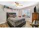 Cozy bedroom featuring built-in window seat, decorative ceiling fan and spacious closet at 7838 Rollingridge Ct, Orlando, FL 32835