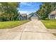 Charming blue home with a well-manicured lawn and inviting curb appeal in a beautiful setting at 7838 Rollingridge Ct, Orlando, FL 32835