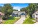 Charming blue home with a well-manicured lawn and inviting curb appeal in a beautiful setting at 7838 Rollingridge Ct, Orlando, FL 32835