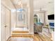 Bright foyer with hardwood floors, a decorative glass door, and a glimpse into the inviting living area at 7838 Rollingridge Ct, Orlando, FL 32835