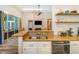 Kitchen view showcasing granite countertops, stainless steel appliances, and modern design at 7838 Rollingridge Ct, Orlando, FL 32835