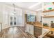 Bright eat-in kitchen with granite counters, stainless steel appliances, and backyard access at 7838 Rollingridge Ct, Orlando, FL 32835