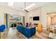 Living room with vaulted ceilings, brick fireplace, and lots of natural light at 7838 Rollingridge Ct, Orlando, FL 32835