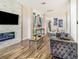 Bright living room with a stone fireplace, hardwood floors, and comfortable seating, perfect for relaxation at 7838 Rollingridge Ct, Orlando, FL 32835